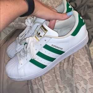 Adidas superstar green stripes!